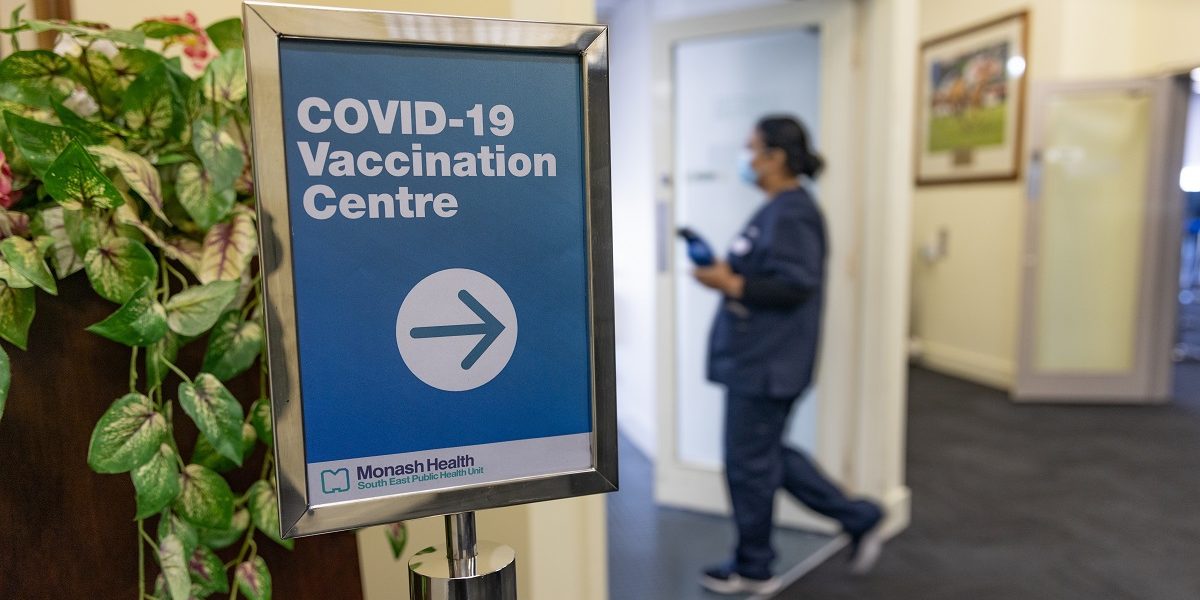 Woman entering COVID-19 Vaccination Centre