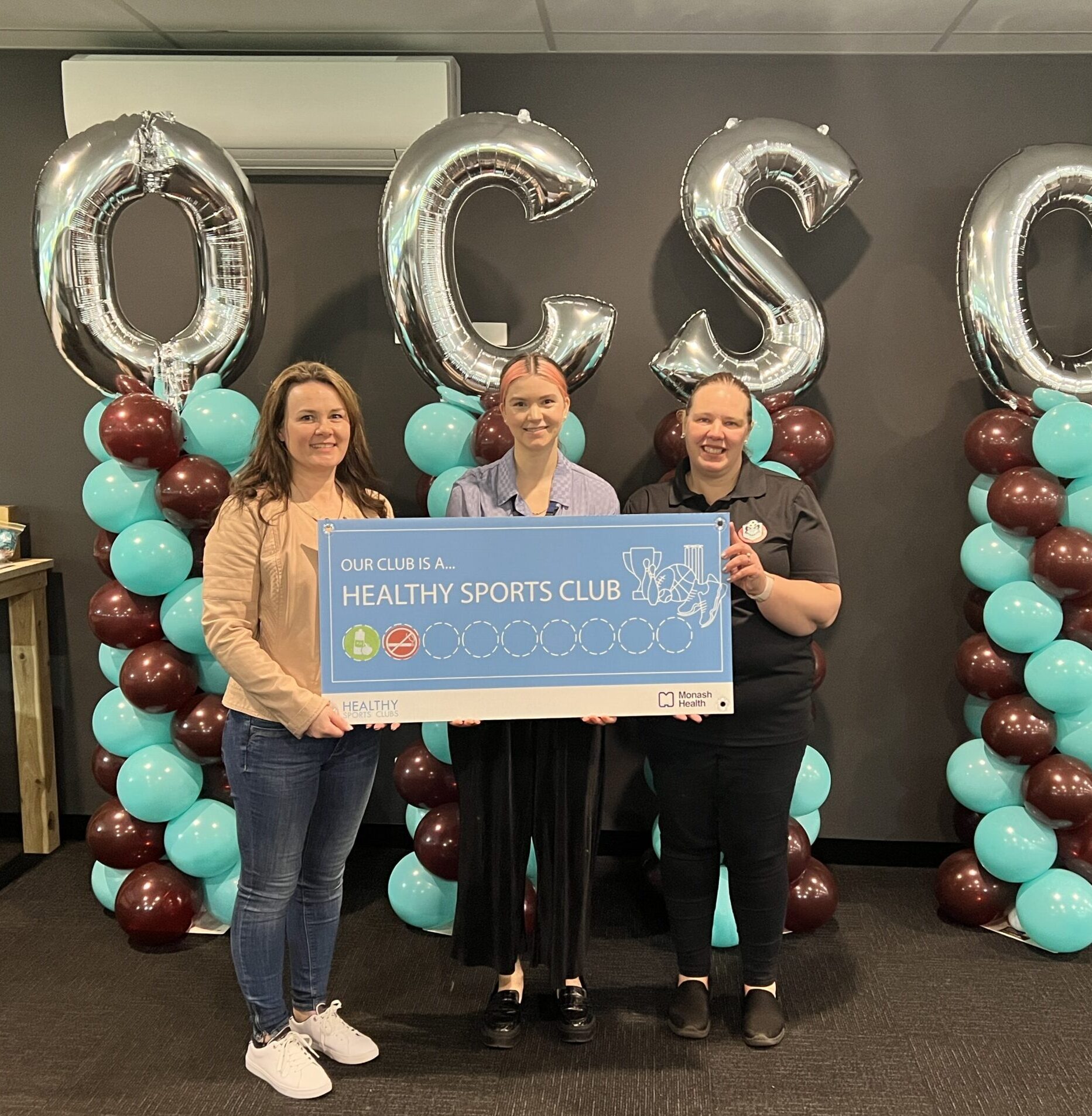 Health Promotion Practitioner, Cassandra, celebrates Officer City Soccer Club being recognised for the Healthy Food & Beverages and Smoke Free Clubs areas.