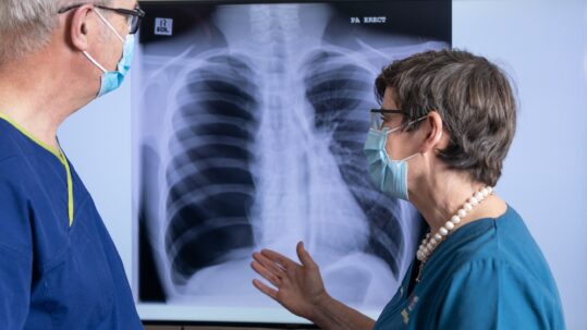 Doctors looking at a chest x-ray